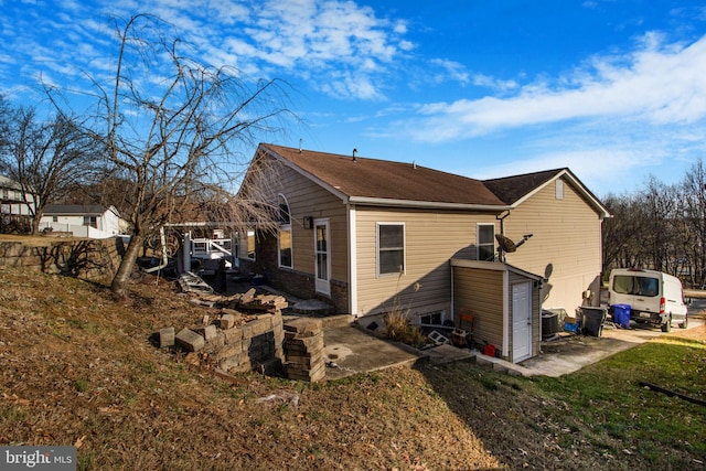 view of home's exterior with central AC unit