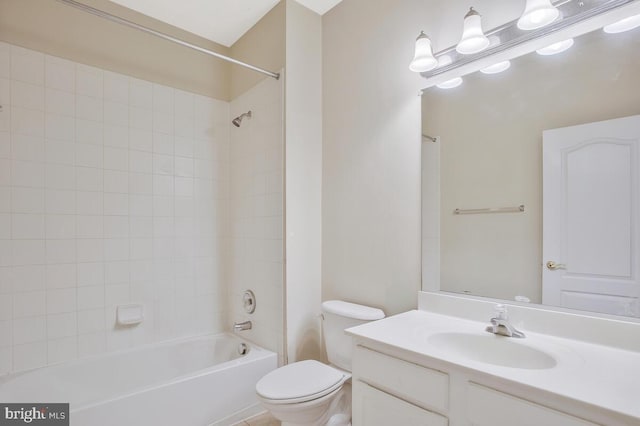 full bathroom featuring vanity, toilet, and tiled shower / bath combo