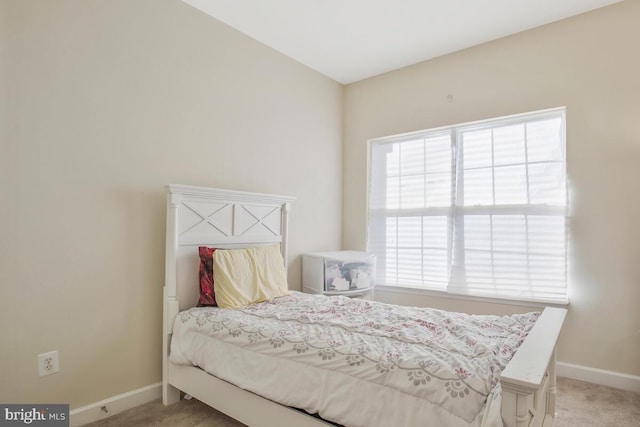 bedroom featuring light colored carpet