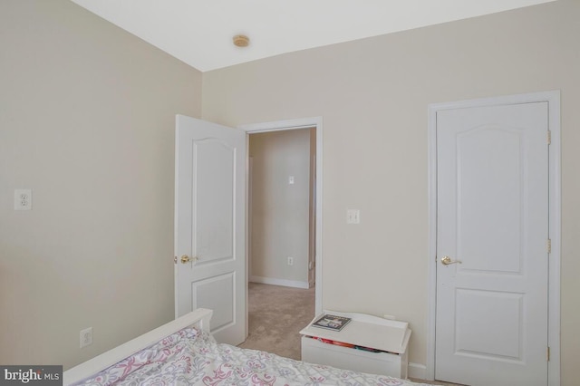 bedroom with light colored carpet