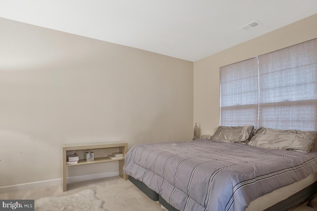 bedroom with light carpet