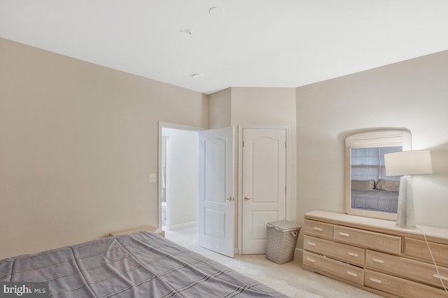 unfurnished bedroom with light colored carpet