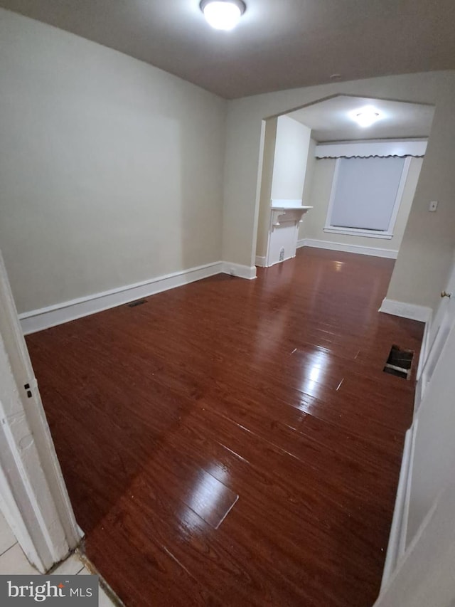 empty room featuring dark wood-type flooring