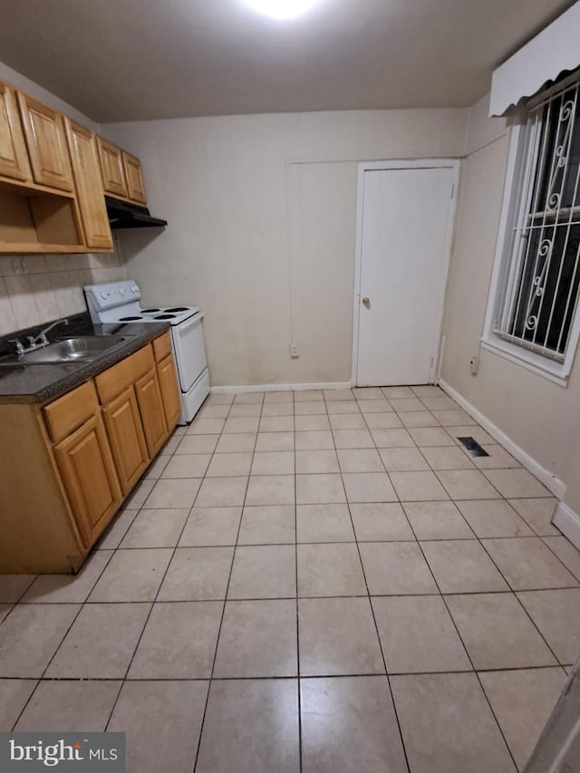 kitchen with white range with electric cooktop, decorative backsplash, sink, and light tile patterned floors