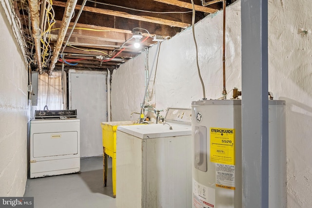 washroom featuring electric water heater and washer and dryer