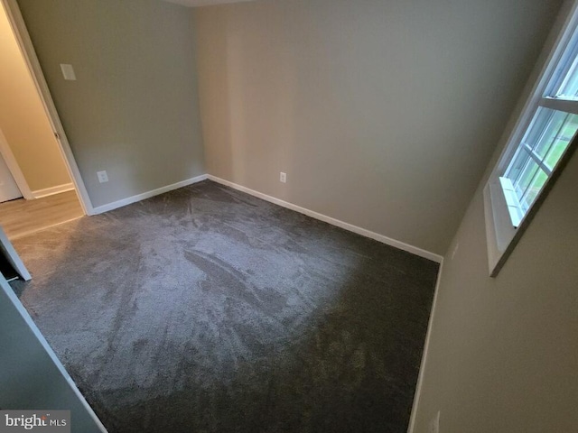 spare room featuring carpet