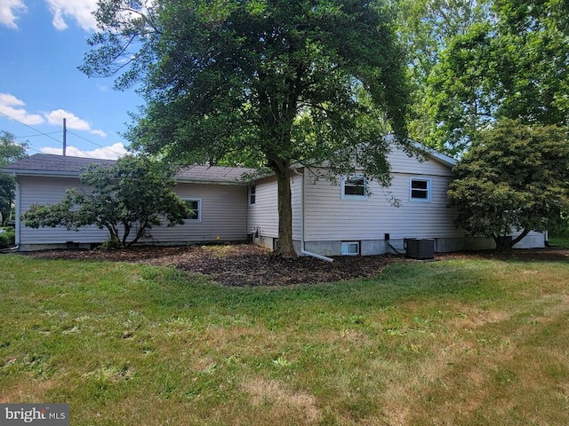 view of side of property with a yard