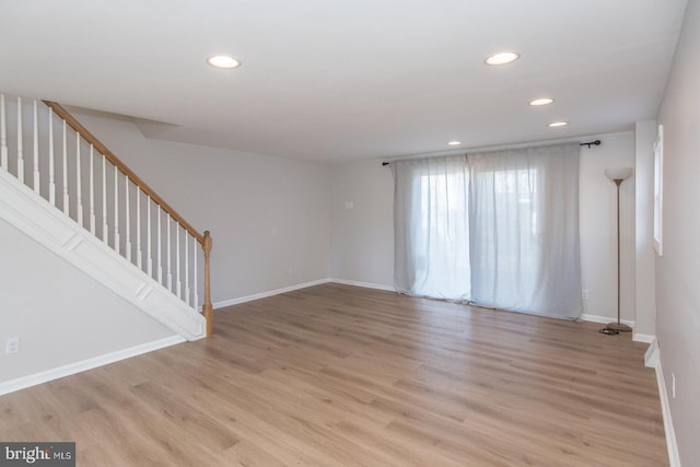 empty room with light hardwood / wood-style floors