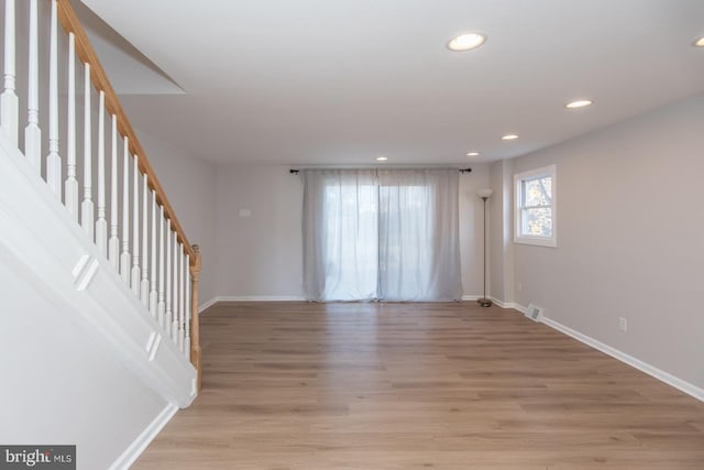 spare room with light hardwood / wood-style flooring