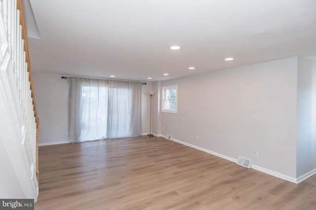 empty room with light hardwood / wood-style floors