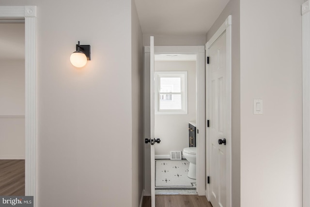 hallway with light wood-type flooring