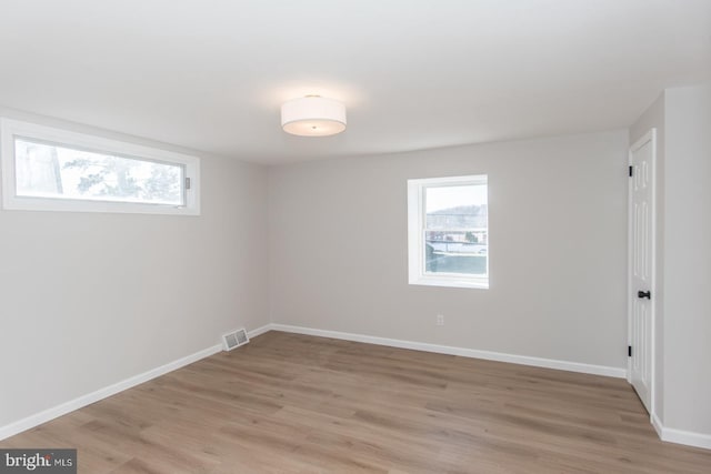 unfurnished room featuring light hardwood / wood-style flooring