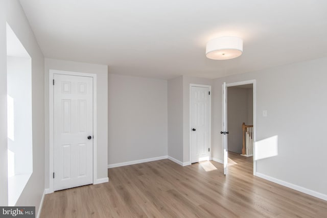 unfurnished room featuring light hardwood / wood-style floors