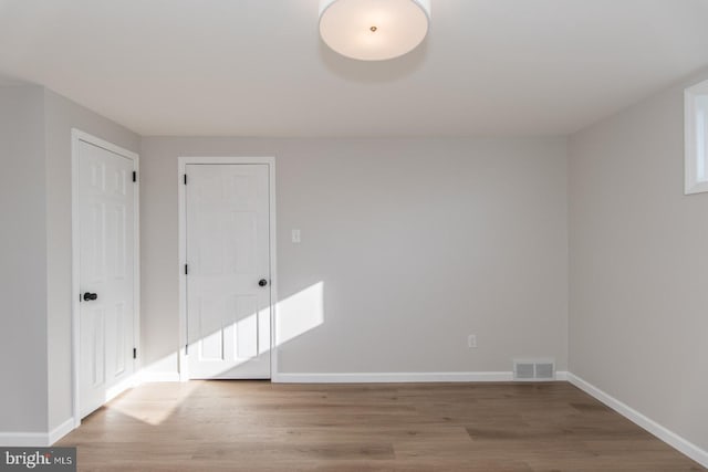 empty room with light wood-type flooring