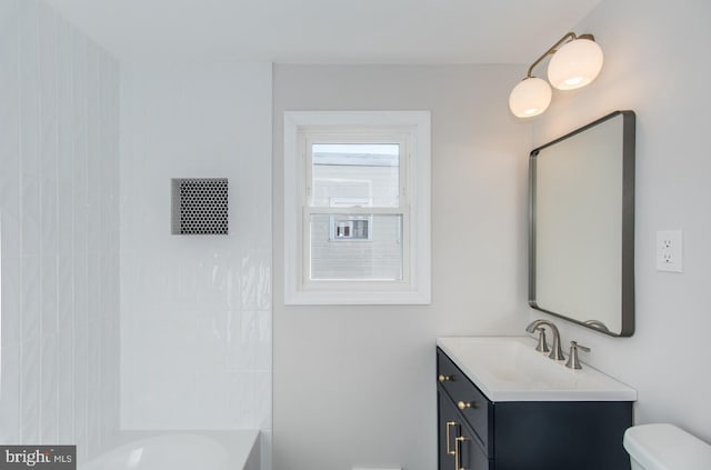 bathroom featuring vanity and toilet