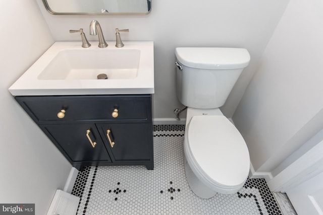 bathroom with tile patterned floors, vanity, and toilet