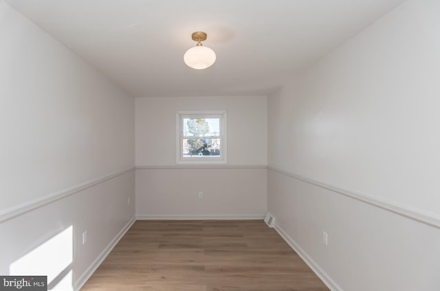 spare room featuring hardwood / wood-style floors