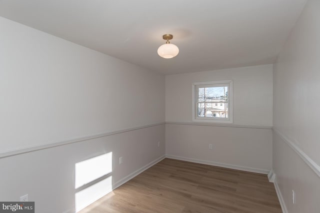 spare room featuring hardwood / wood-style flooring