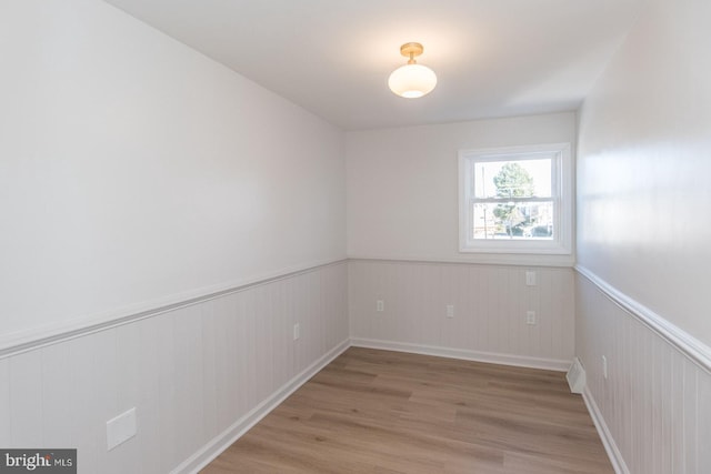 empty room with light hardwood / wood-style floors