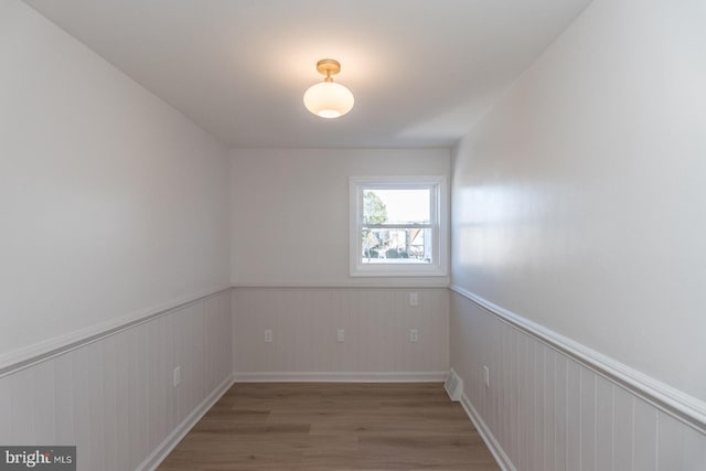 empty room featuring wood-type flooring