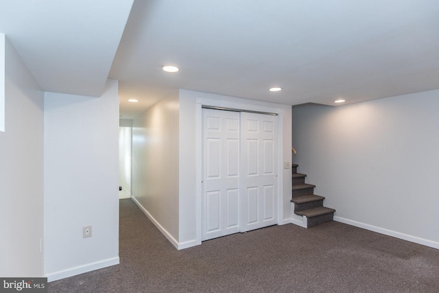 basement with dark carpet