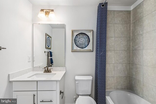 full bathroom with vanity, toilet, and shower / tub combo