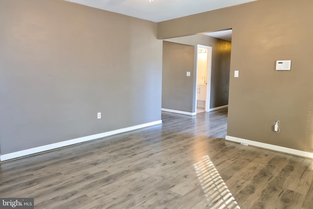 empty room with wood-type flooring