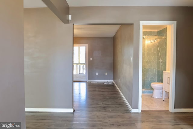 hallway with dark hardwood / wood-style flooring