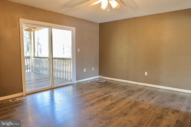 unfurnished room with hardwood / wood-style flooring and ceiling fan