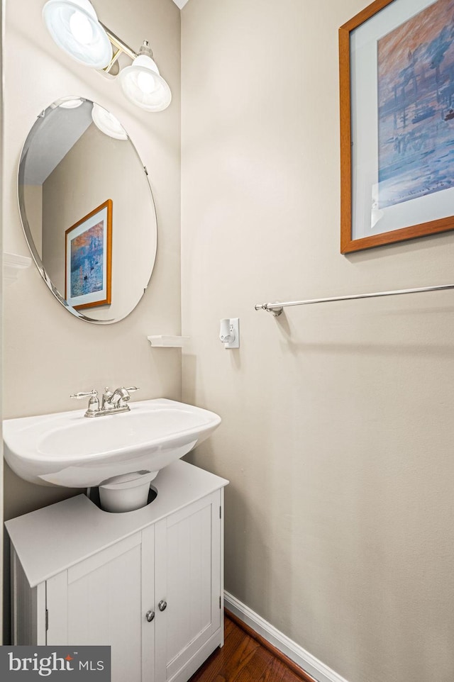 bathroom with hardwood / wood-style floors and vanity