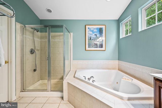 bathroom featuring tile patterned floors, vanity, lofted ceiling, and shower with separate bathtub