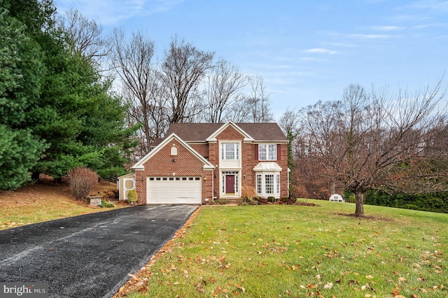 front of property featuring a garage and a front lawn