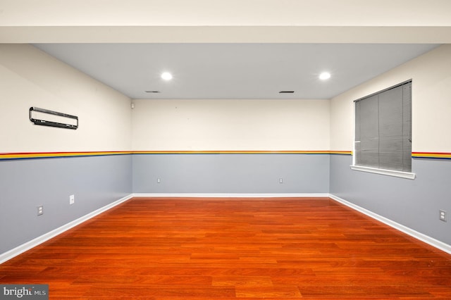 empty room with hardwood / wood-style floors