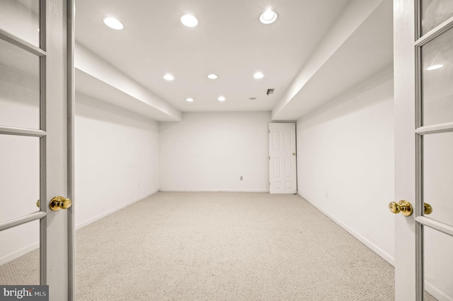 unfurnished room with light carpet