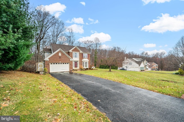 view of front property featuring a garage and a front lawn