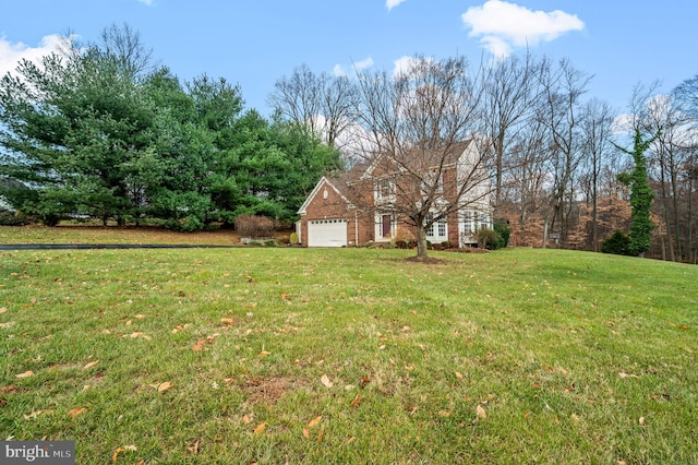 view of yard with a garage