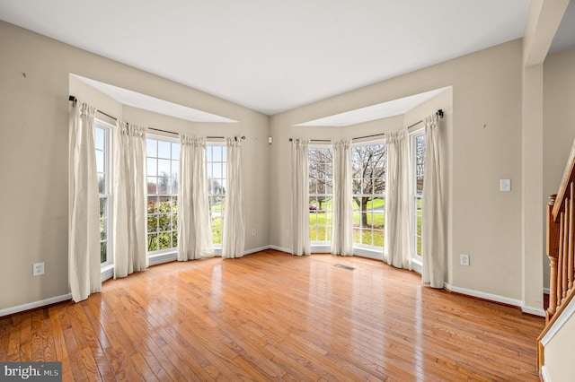 interior space featuring plenty of natural light and light hardwood / wood-style floors