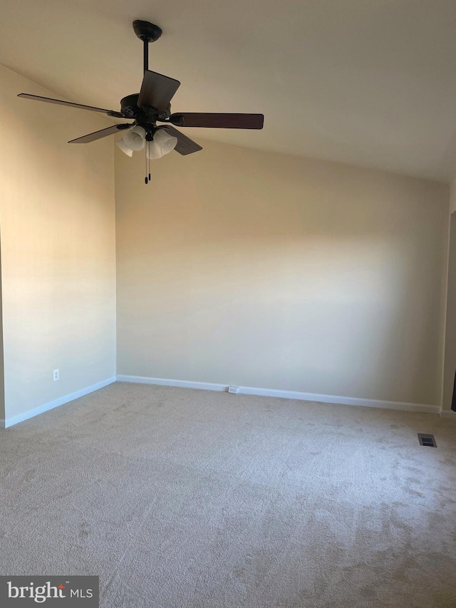 empty room featuring ceiling fan and carpet floors