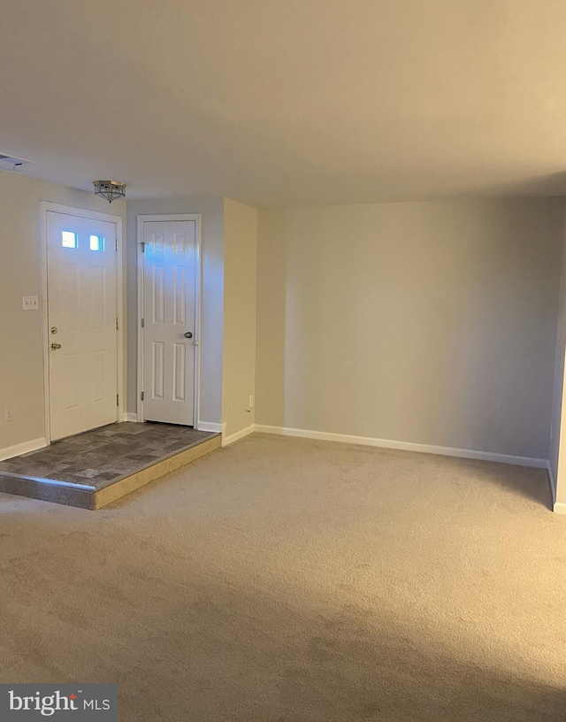 entrance foyer featuring carpet floors