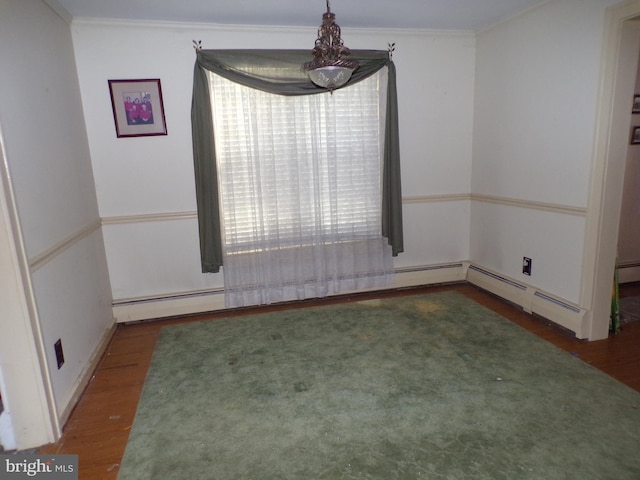 unfurnished dining area with baseboard heating, crown molding, and dark wood-type flooring