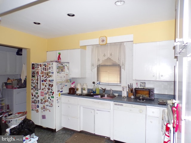 kitchen featuring white cabinetry, white appliances, sink, and washer / clothes dryer