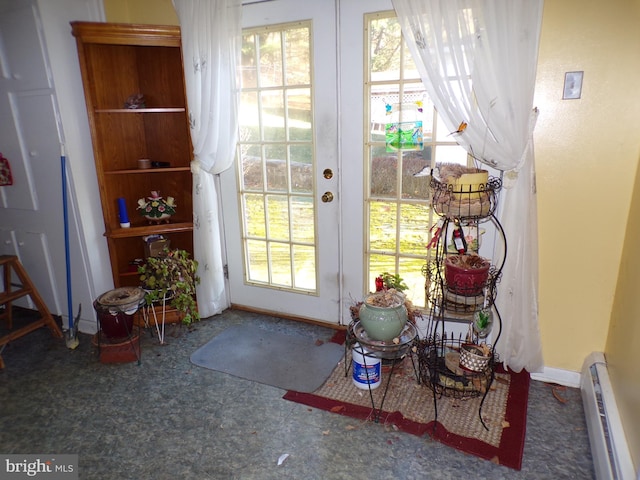 entryway with french doors and baseboard heating