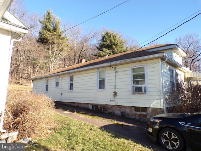 view of home's exterior featuring cooling unit