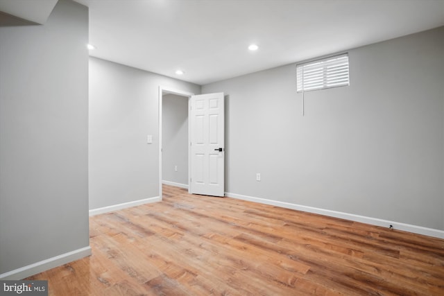 basement with light hardwood / wood-style floors