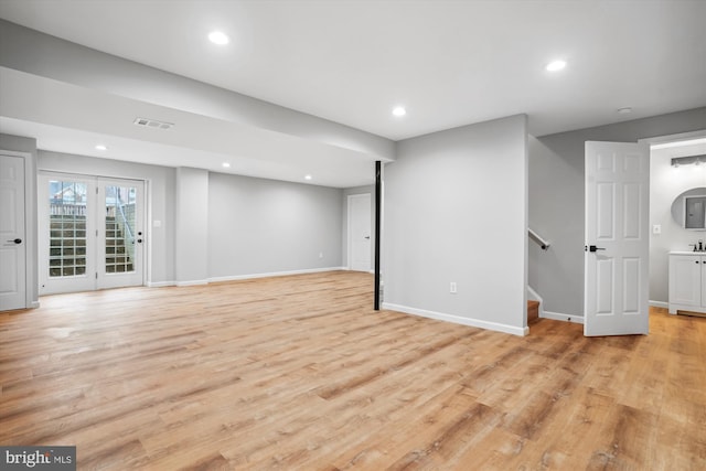 basement featuring light hardwood / wood-style flooring