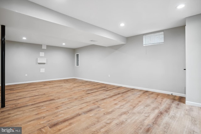 basement featuring light hardwood / wood-style floors