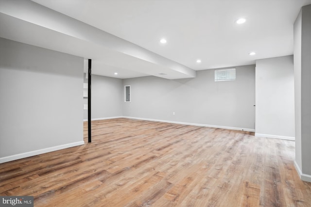 basement featuring light wood-type flooring