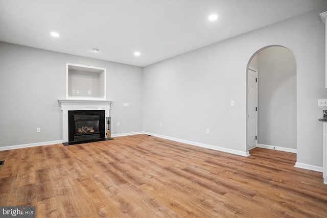 unfurnished living room with light wood-type flooring