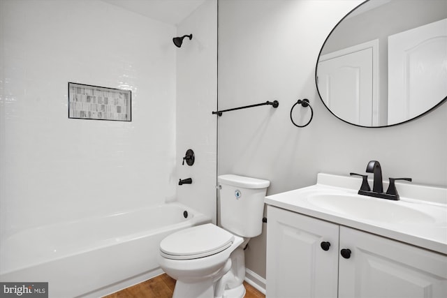 full bathroom with hardwood / wood-style floors, vanity, toilet, and shower / bath combination