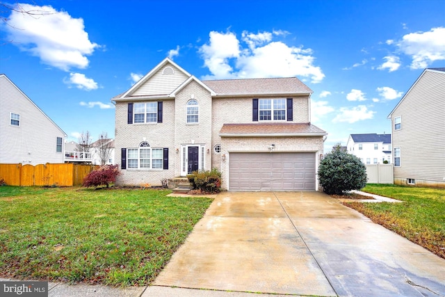 view of front facade with a garage and a front lawn